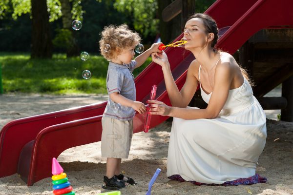 Mom and boy blowing bubbles