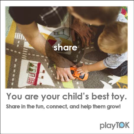 image of father playing cars with son